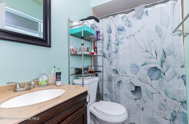 1661 Sandusky St SE, Palm Bay, FL 32909 - bathroom featuring vanity and a shower with shower curtain