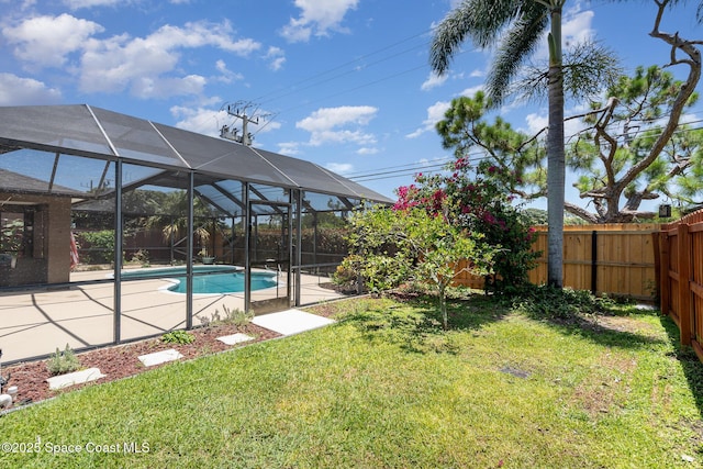713 Del Mar Cir, Melbourne, FL 32904 - fenced backyard featuring a patio and glass enclosure