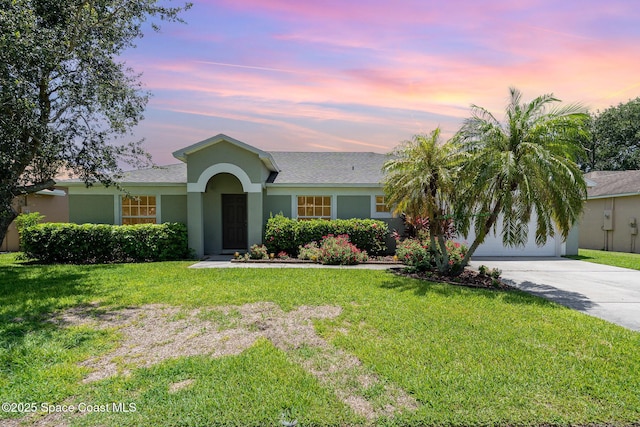 713 Del Mar Cir, Melbourne, FL 32904 - ranch-style house with stucco siding, driveway, and a front lawn