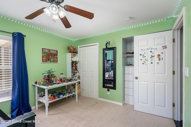 713 Del Mar Cir, Melbourne, FL 32904 - game room with ceiling fan and light carpet