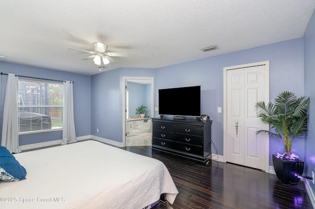 713 Del Mar Cir, Melbourne, FL 32904 - bedroom with dark wood finished floors, ceiling fan, and a textured ceiling