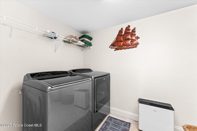 121 Lancha Cir Unit 203, Indian Harbour Beach, FL 32937 - washroom featuring independent washer and dryer and baseboards
