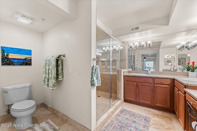 121 Lancha Cir Unit 203, Indian Harbour Beach, FL 32937 - bathroom with a shower stall, double vanity, a chandelier, and a textured ceiling