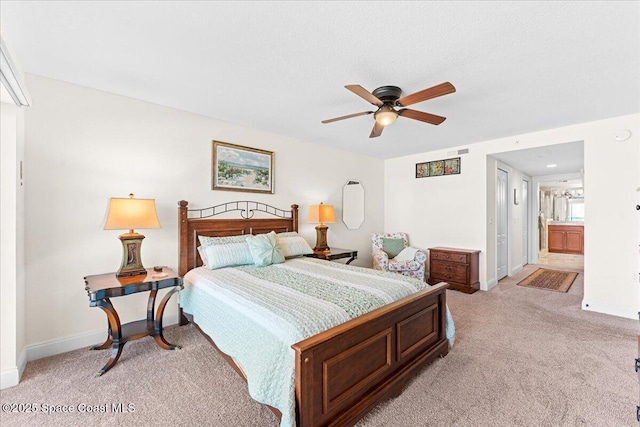 121 Lancha Cir Unit 203, Indian Harbour Beach, FL 32937 - bedroom featuring light carpet, ensuite bath, and a ceiling fan
