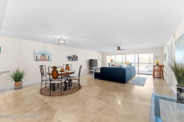 121 Lancha Cir Unit 203, Indian Harbour Beach, FL 32937 - dining room with a textured ceiling and ceiling fan
