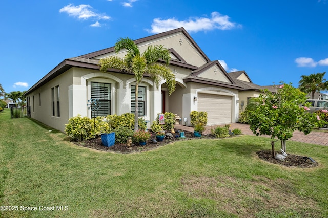 4729 Alligator Flag Cir, West Melbourne, FL 32904 - view of front of property featuring stucco siding, a garage, a front yard, and driveway