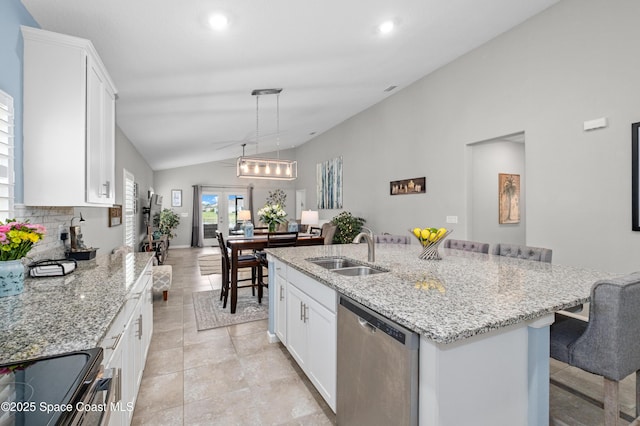 4729 Alligator Flag Cir, West Melbourne, FL 32904 - kitchen featuring dishwasher, lofted ceiling, white cabinetry, light stone counters, and a kitchen island with sink