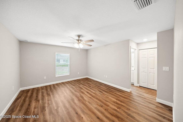 1011 Webster Rd SE, Palm Bay, FL 32909 - empty room with wood finished floors and ceiling fan