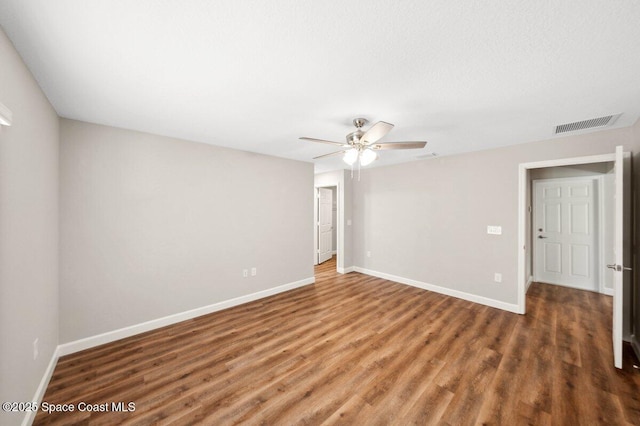 1011 Webster Rd SE, Palm Bay, FL 32909 - unfurnished room featuring a ceiling fan and wood finished floors