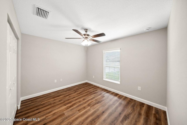 1011 Webster Rd SE, Palm Bay, FL 32909 - unfurnished bedroom with a closet, dark wood-style flooring, and ceiling fan