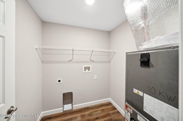 1011 Webster Rd SE, Palm Bay, FL 32909 - washroom with washer hookup, dark wood-style floors, heating unit, and electric dryer hookup
