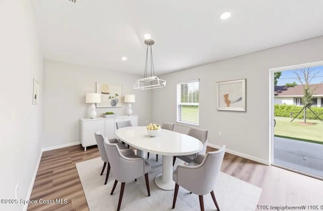 1011 Webster Rd SE, Palm Bay, FL 32909 - dining area featuring healthy amount of natural light, wood finished floors, and recessed lighting