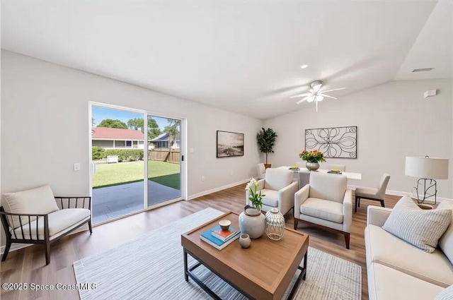 1011 Webster Rd SE, Palm Bay, FL 32909 - living room featuring wood finished floors, lofted ceiling, and a ceiling fan