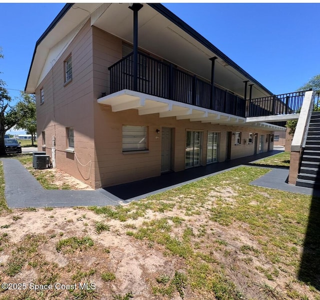 1715 Dixon Blvd Unit 102, Cocoa, FL 32922 - back of property featuring stairway