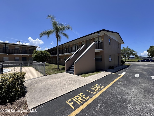 1715 Dixon Blvd Unit 102, Cocoa, FL 32922 - view of building exterior with stairs