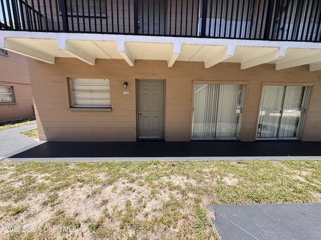 1715 Dixon Blvd Unit 102, Cocoa, FL 32922 - doorway to property featuring a patio area and a balcony