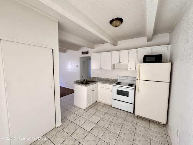 1715 Dixon Blvd Unit 102, Cocoa, FL 32922 - kitchen with white appliances, beamed ceiling, a textured ceiling, white cabinetry, and light tile patterned flooring