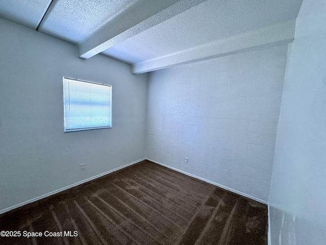 1715 Dixon Blvd Unit 102, Cocoa, FL 32922 - empty room featuring beamed ceiling, a textured ceiling, and dark carpet