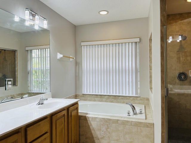 117 Anchorage Ave Unit 6, Cape Canaveral, FL 32920 - bathroom featuring a bath, vanity, and a shower stall
