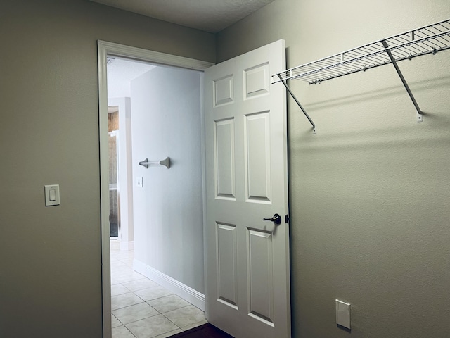 117 Anchorage Ave Unit 6, Cape Canaveral, FL 32920 - corridor featuring light tile patterned floors and baseboards