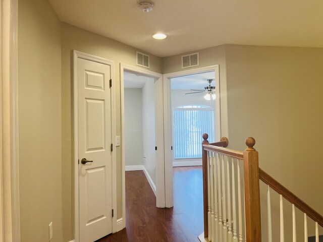 117 Anchorage Ave Unit 6, Cape Canaveral, FL 32920 - corridor with an upstairs landing, dark wood-style flooring, and recessed lighting