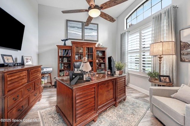 5197 Kirkwall Cir, Melbourne, FL 32940 - home office featuring healthy amount of natural light, a ceiling fan, and light wood-style flooring