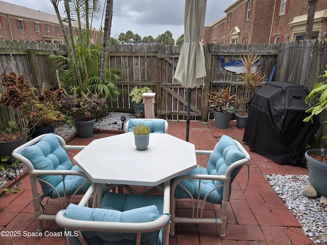 152 E Colonial Ct Unit 84, Indian Harbour Beach, FL 32937 - view of patio / terrace with grilling area and outdoor dining space