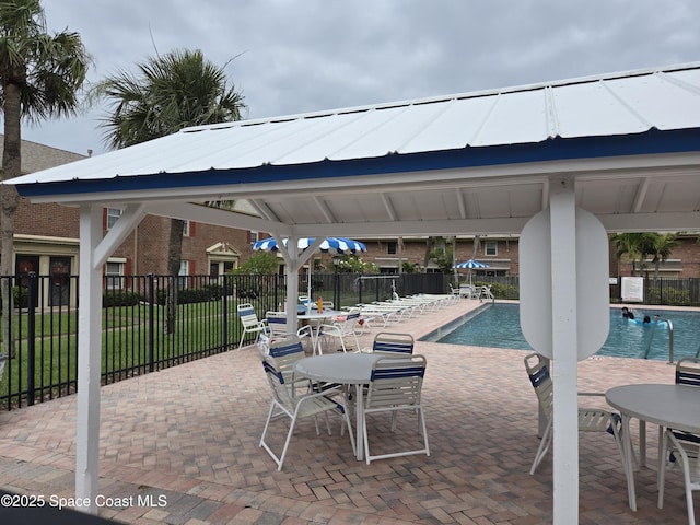 152 E Colonial Ct Unit 84, Indian Harbour Beach, FL 32937 - community pool with a gazebo and a patio
