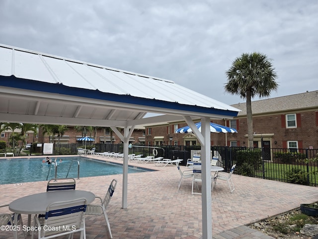 152 E Colonial Ct Unit 84, Indian Harbour Beach, FL 32937 - community pool featuring a patio area
