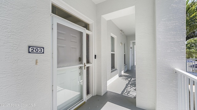 420 Moore Park Ln Unit 203, Merritt Island, FL 32952 - doorway to property featuring stucco siding
