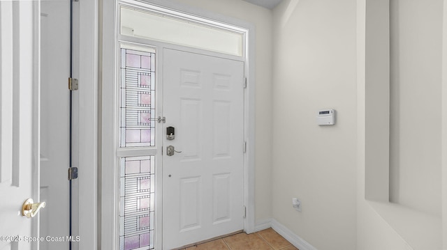 420 Moore Park Ln Unit 203, Merritt Island, FL 32952 - foyer entrance with light tile patterned floors and baseboards
