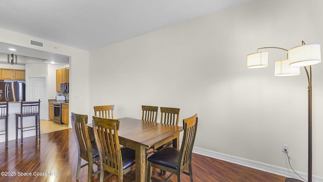 420 Moore Park Ln Unit 203, Merritt Island, FL 32952 - dining room featuring light wood-style floors