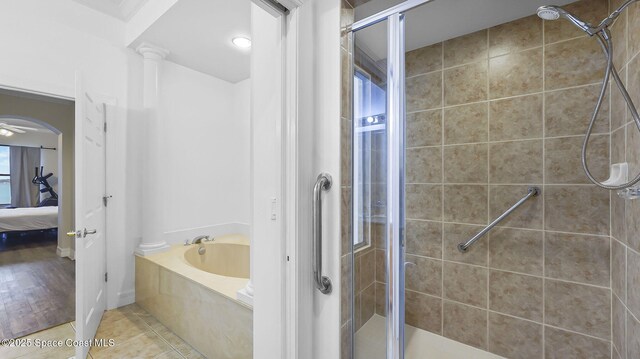 420 Moore Park Ln Unit 203, Merritt Island, FL 32952 - ensuite bathroom with a shower stall, a garden tub, and tile patterned floors