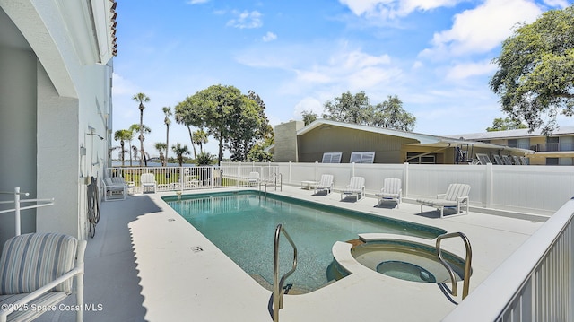 420 Moore Park Ln Unit 203, Merritt Island, FL 32952 - view of swimming pool with a patio area, a fenced backyard, and a pool with connected hot tub