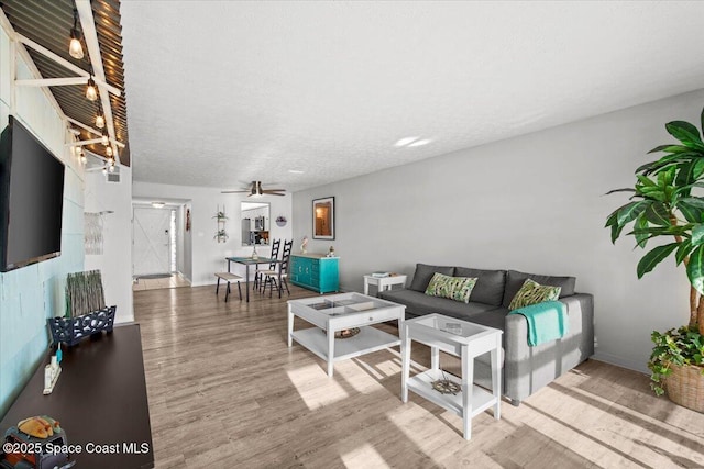 1611 Minutemen Cswy Unit 107-Hh, Cocoa Beach, FL 32931 - living room with wood finished floors and a ceiling fan