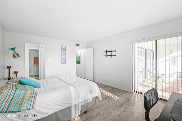 1611 Minutemen Cswy Unit 107-Hh, Cocoa Beach, FL 32931 - bedroom with light wood-type flooring and baseboards
