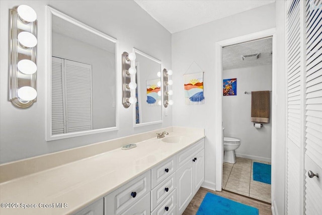 1611 Minutemen Cswy Unit 107-Hh, Cocoa Beach, FL 32931 - bathroom featuring a closet, vanity, and a textured ceiling