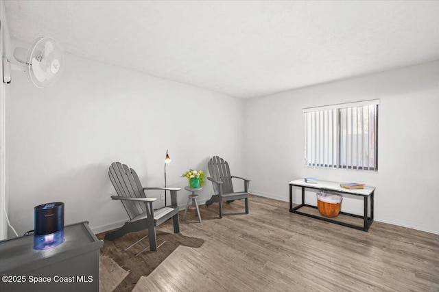 1611 Minutemen Cswy Unit 107-Hh, Cocoa Beach, FL 32931 - sitting room with wood finished floors and baseboards