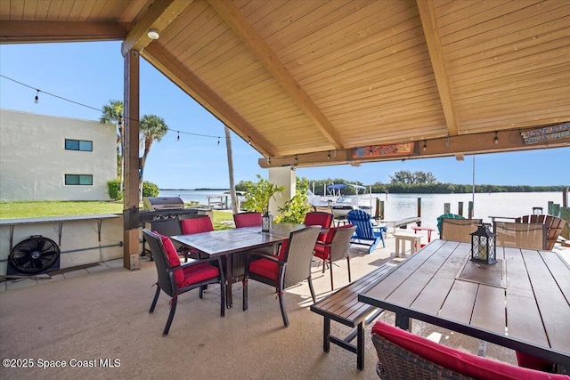 1611 Minutemen Cswy Unit 107-Hh, Cocoa Beach, FL 32931 - view of patio with outdoor dining area and a water view