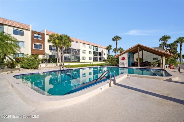1611 Minutemen Cswy Unit 107-Hh, Cocoa Beach, FL 32931 - community pool featuring a patio area