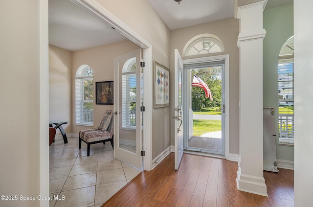 2351 Stonebridge Dr, Rockledge, FL 32955 - foyer featuring ornate columns and light wood-type flooring