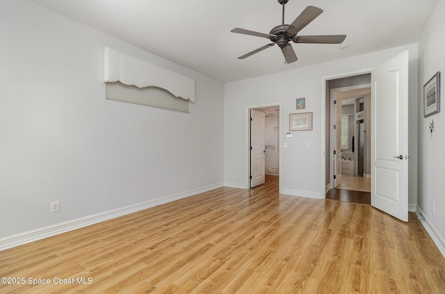 2351 Stonebridge Dr, Rockledge, FL 32955 - unfurnished bedroom with light wood-type flooring, a walk in closet, and a ceiling fan