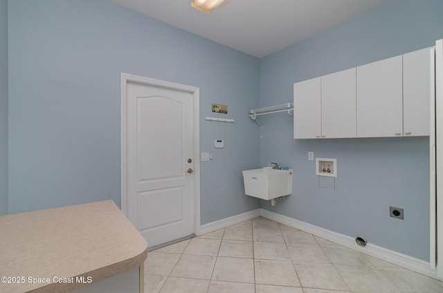 2351 Stonebridge Dr, Rockledge, FL 32955 - laundry room featuring cabinet space, electric dryer hookup, hookup for a washing machine, and light tile patterned floors