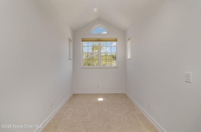 2351 Stonebridge Dr, Rockledge, FL 32955 - unfurnished room featuring light carpet and vaulted ceiling