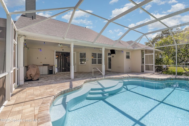 2351 Stonebridge Dr, Rockledge, FL 32955 - swimming pool with a patio area, a ceiling fan, and glass enclosure