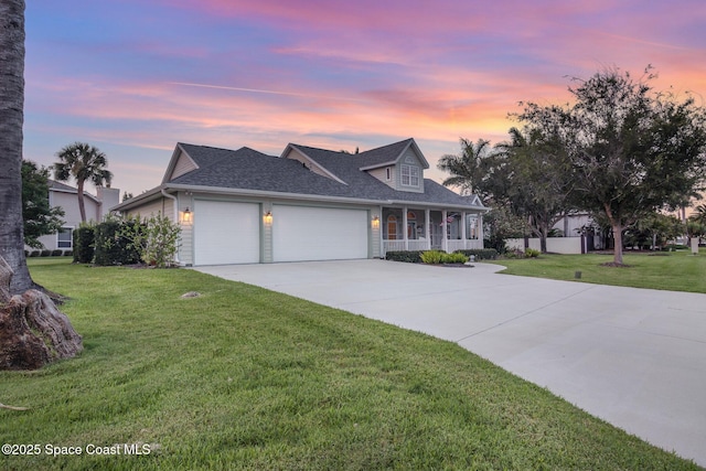 2351 Stonebridge Dr, Rockledge, FL 32955 - view of front facade with an attached garage, a porch, a front yard, driveway, and a shingled roof