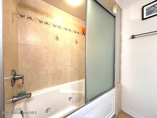 961 Haas Ave NE, Palm Bay, FL 32907 - bathroom featuring a combined bath / shower with jetted tub