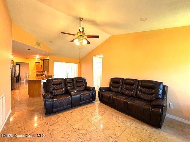 961 Haas Ave NE, Palm Bay, FL 32907 - living area with vaulted ceiling and ceiling fan