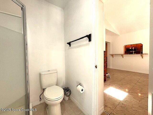 961 Haas Ave NE, Palm Bay, FL 32907 - full bathroom featuring an enclosed shower and vaulted ceiling