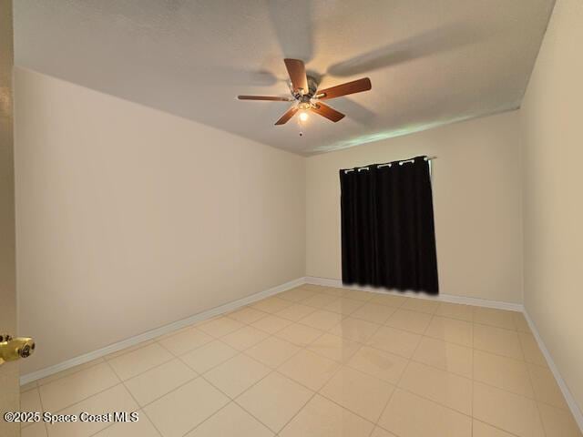 961 Haas Ave NE, Palm Bay, FL 32907 - spare room with a ceiling fan and baseboards